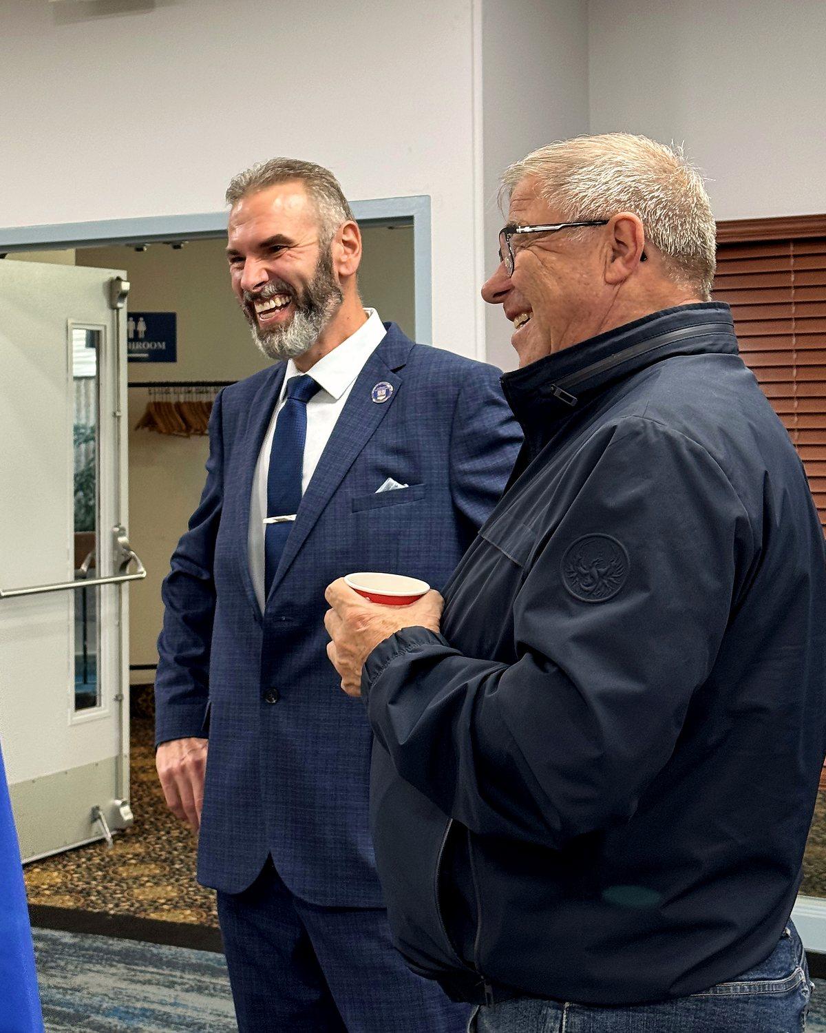 Stacy Miskew sharing a laugh with a resident in Lloydminster